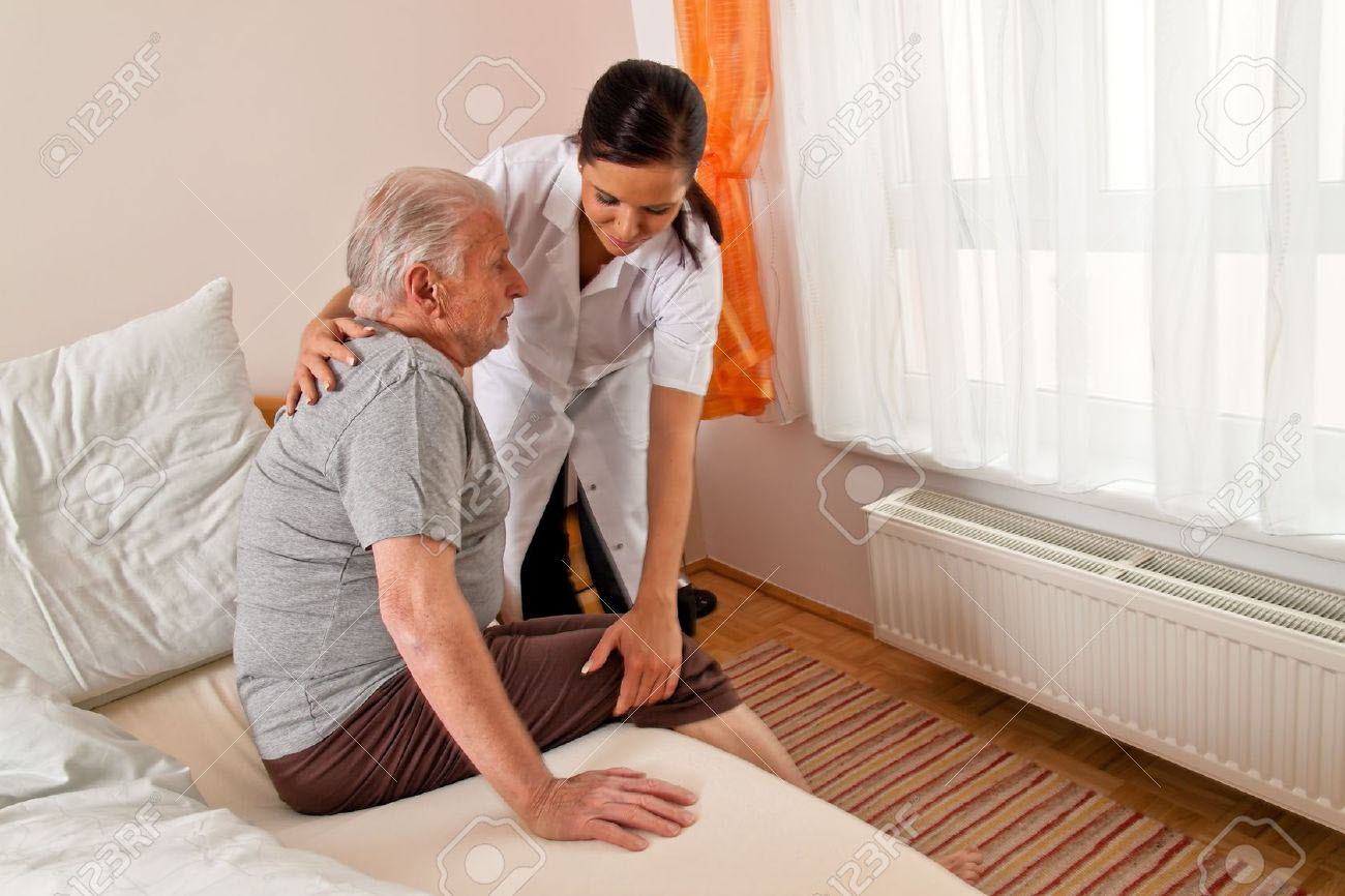 Nurse Helping Old Man To Stand Up - In Home Aged Care - ESP Healthcare