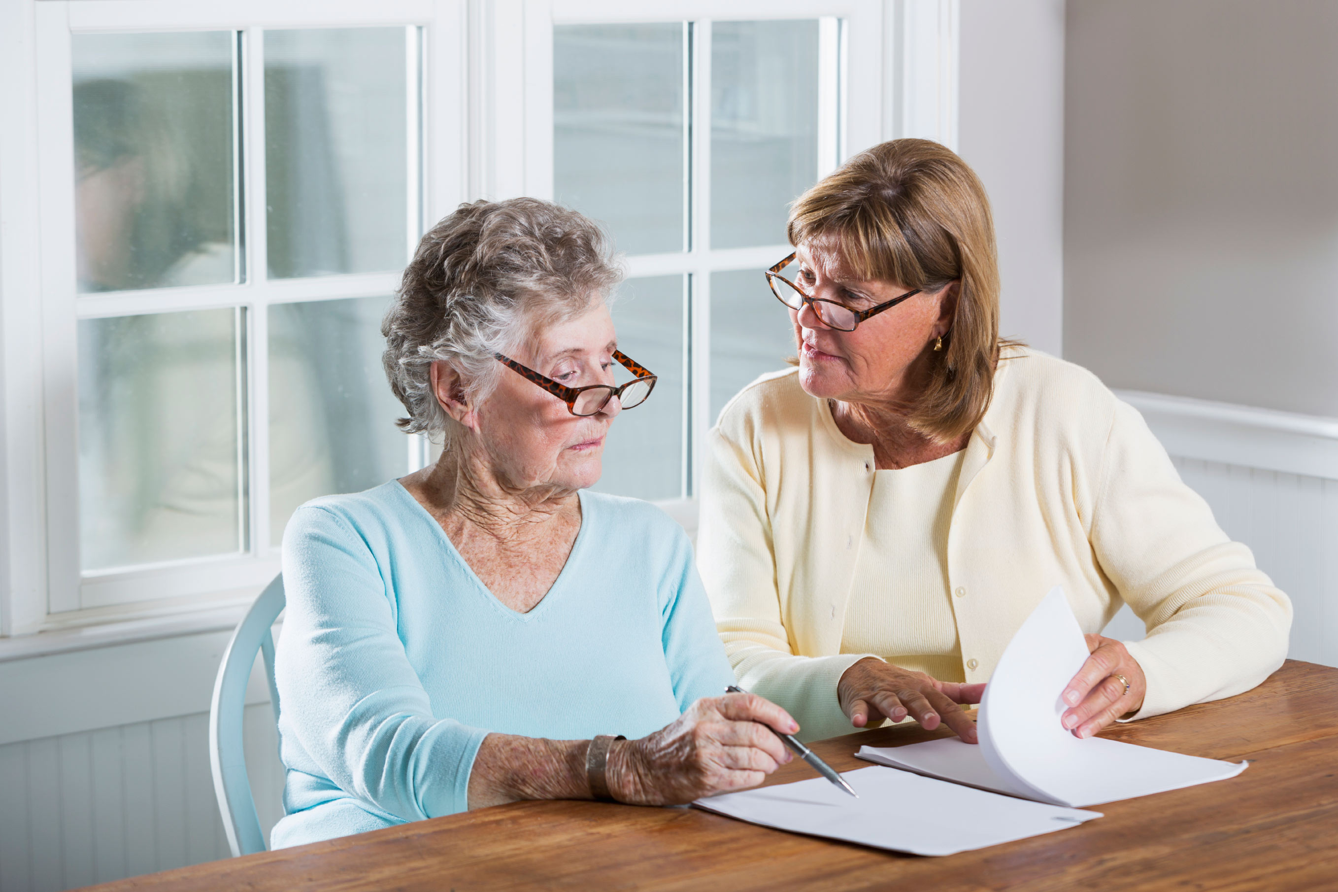 A Woman Explaining Something To The Senior Woman - Case Management In Aged Care - ESP Healthcare